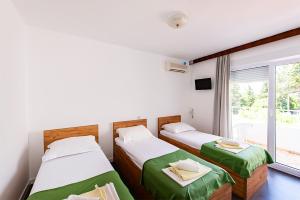 Posteľ alebo postele v izbe v ubytovaní Villa Christina