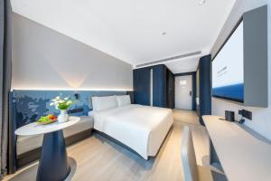 Postelja oz. postelje v sobi nastanitve Atour Light Hotel Chengdu Kuanzhai Alley