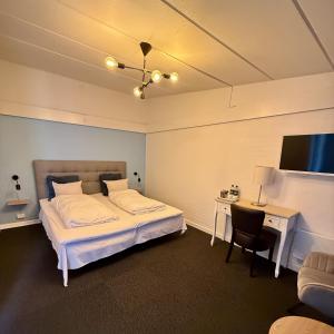 Voodi või voodid majutusasutuse Hotel Birksø toas