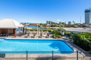 a swimming pool on the roof of a building at Moorings On Cavill Surfers Paradise in Gold Coast