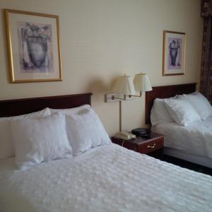 Säng eller sängar i ett rum på Maron Hotel & Suites