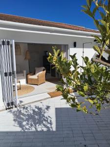 a view of a living room from the porch of a house at Klein Griekebaan Langebaan in Langebaan