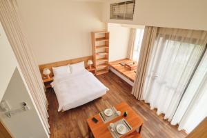 Letto o letti in una camera di Wutong Hotel Apartment Bao'an Center