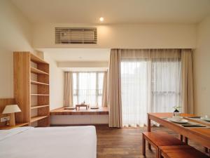 Letto o letti in una camera di Wutong Hotel Apartment Bao'an Center