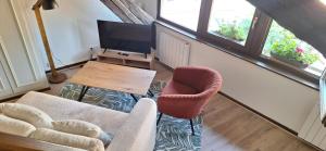 TV a/nebo společenská místnost v ubytování Gîte ramloc