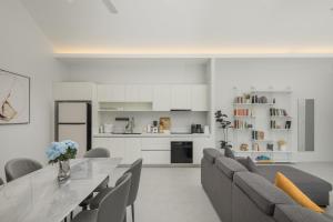 a kitchen and living room with a table and chairs at Silk Villa - 3 Bedrooms - Pool - Central Area in Bophut