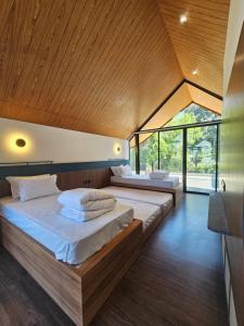 Postel nebo postele na pokoji v ubytování Villa Daun Trinity K22 + 8 fotografií