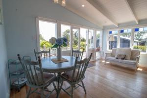 a dining room with a table and chairs at The Homestead - a rural family retreat in Sentry Hill