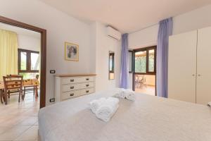 A bed or beds in a room at Agriturismo Le Vecchie Scuole Még 103 kép