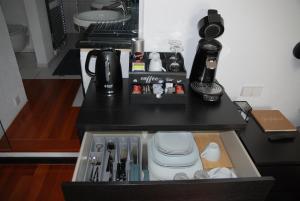 a counter top with a coffee maker and a sink at Villa am Buck Lörrach bei Basel in Lörrach