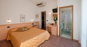 Postel nebo postele na pokoji v ubytování Hotel Jonni