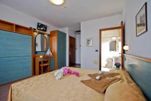 Postel nebo postele na pokoji v ubytování Hotel Jonni