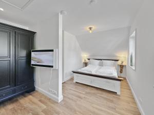 Ένα ή περισσότερα κρεβάτια σε δωμάτιο στο Objekt-Nr 139 - Priwall - Mecklenburger Landstraße