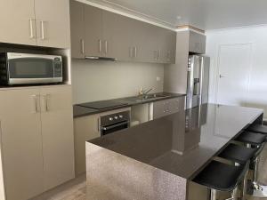 a kitchen with a counter top and a microwave at Bundalong Bliss in Bundalong