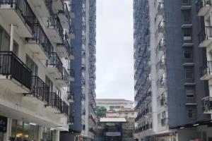 a view from between two tall buildings at Jardin B20, Pool View, Netflix & WIFI in Bandung