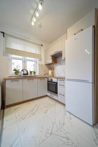 Kuchyň nebo kuchyňský kout v ubytování Soft Apartamenty na Starówce