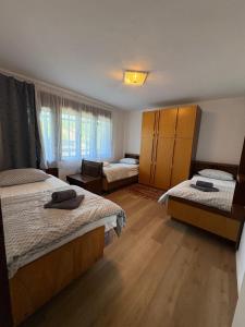 Ένα ή περισσότερα κρεβάτια σε δωμάτιο στο Suzi Apartments