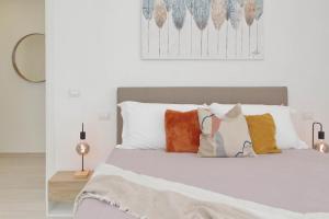 Postel nebo postele na pokoji v ubytování Relax e Vista da Sogno in Attico Ostia