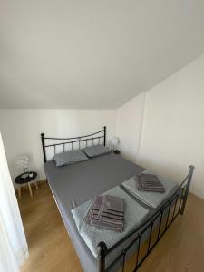 Postel nebo postele na pokoji v ubytování Apartman Melinda