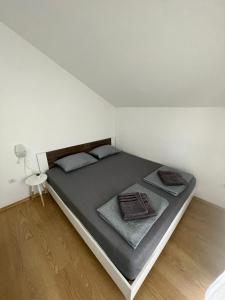 Postel nebo postele na pokoji v ubytování Apartman Melinda