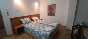 Postel nebo postele na pokoji v ubytování Matev Hotel