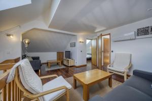 Posezení v ubytování Les jardins du lac - OG IMMO