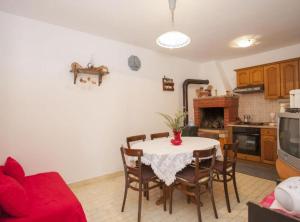 a kitchen with a table and chairs in a room at House B - 45m from the Sea in Vela Luka