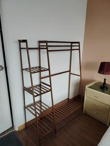 Postel nebo postele na pokoji v ubytování Natol Homestay - Kuching Home Penthouse Airport Road