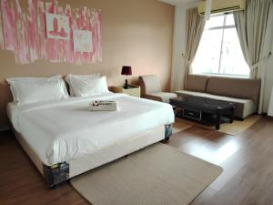 Postel nebo postele na pokoji v ubytování Natol Homestay - Kuching Home Penthouse Airport Road