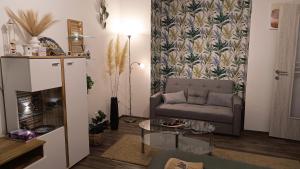 a living room with a couch and a table at Panoráma 4U in Tapolca