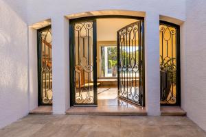 a pair of entry doors to a house at Villa avec piscine in Cabestany