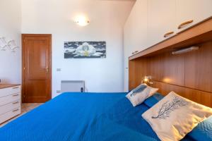 Ένα ή περισσότερα κρεβάτια σε δωμάτιο στο Villetta Luisa