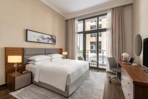 Letto o letti in una camera di Marriott Executive Apartments Doha, Le Mirage City Walk