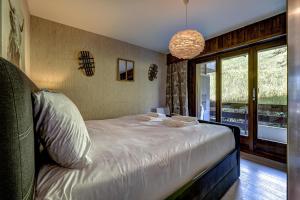 Postel nebo postele na pokoji v ubytování Appartement LaForet 62