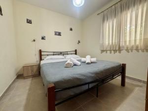 Ένα ή περισσότερα κρεβάτια σε δωμάτιο στο Casa al Mare