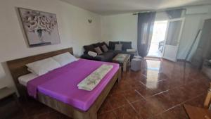 Postel nebo postele na pokoji v ubytování Apartman Mario