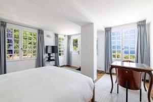 Łóżko lub łóżka w pokoju w obiekcie Villa Ocean Breeze