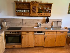 Kuchyň nebo kuchyňský kout v ubytování Apartment Hochsteinalm + 12 fotografií
