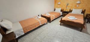 Ліжко або ліжка в номері Hotel Palladion