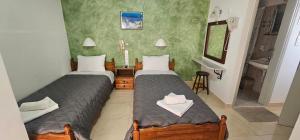 Ліжко або ліжка в номері Hotel Palladion