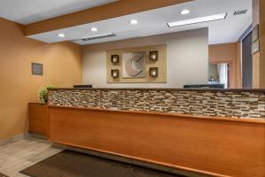 a lobby of a hospital with a reception counter at Comfort Inn & Suites Orlando North in Sanford +37 photos