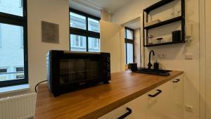 Kuchyň nebo kuchyňský kout v ubytování Design City Apartments + 11 fotografií