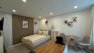 Postel nebo postele na pokoji v ubytování Design City Apartments