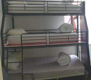 a couple of bunk beds with towels on them at AT Home in Burgas