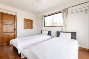 Fieldnever Apartment STAY - Maisonette Family room客房内的一张或多张床位