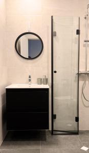 a bathroom with a sink and a mirror at Sea Vacation Homes in Chernomorets +31 photos