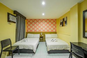 Postel nebo postele na pokoji v ubytování Hotel Juliano + 16 fotografií