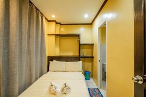 Postel nebo postele na pokoji v ubytování Hotel Juliano