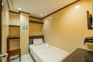 Postel nebo postele na pokoji v ubytování Hotel Juliano