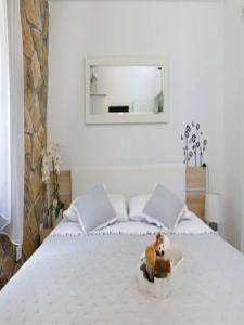 a bed with a teddy bear in a box on it at Holiday Home Lišnjak in Drniš +22 photos